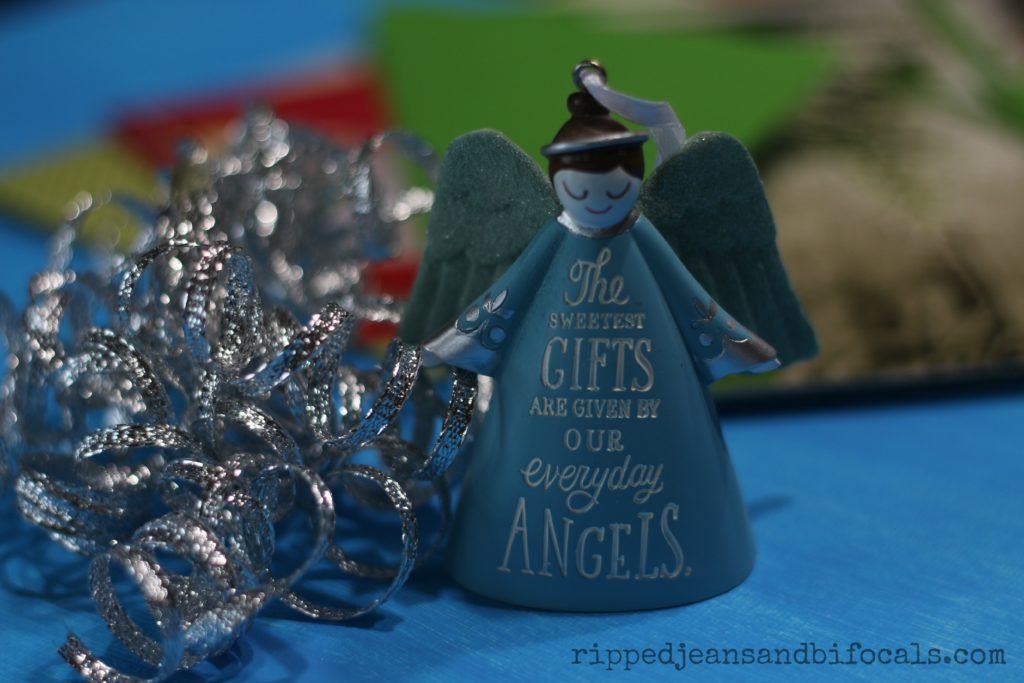 Hallmark ornaments are also available at Walmart. I buy new ornaments for my family every year but I usually don't get one for me. This year, I did. Everyday angels really do exist and I'll remember that kind woman I met in the card aisle at Walmart every time I put my tree up.