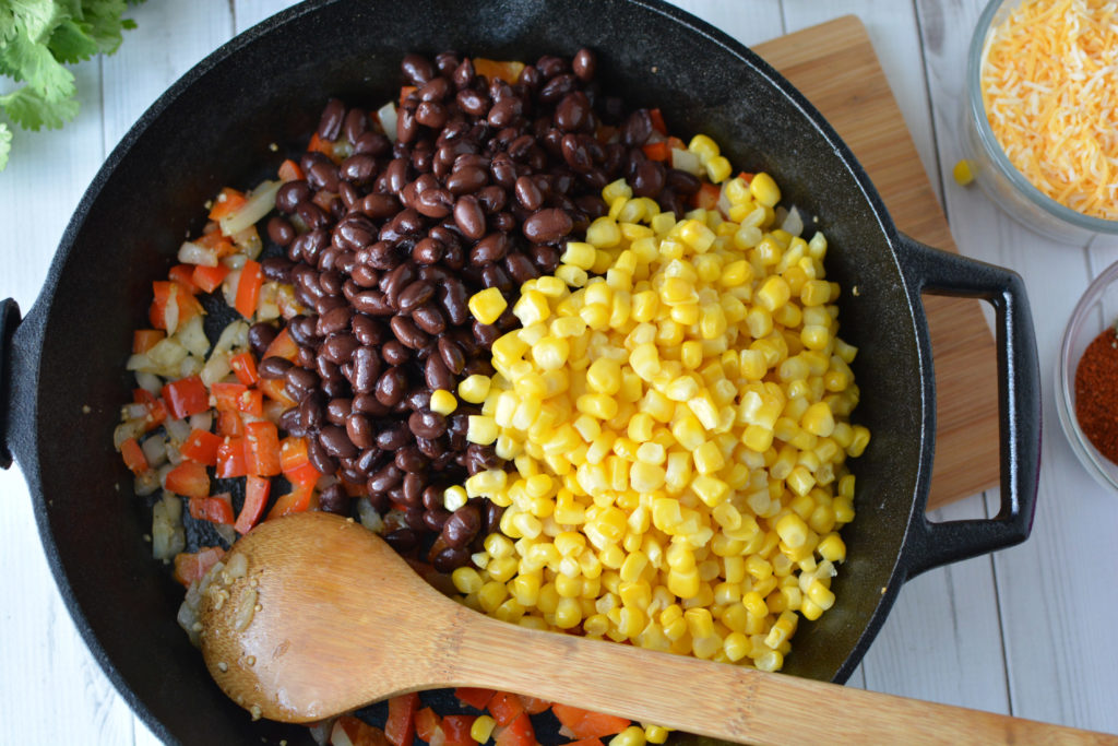 This easy enchilada skillet dinner is one of my family's go-to weeknight dinners. This easy, weeknight, one skillet meatless meal can be made with ingreidents you probably have on hand|Ripped Jeans and Bifocals