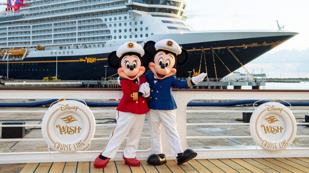 Mickey and Minnie in front of the Disney Wish.