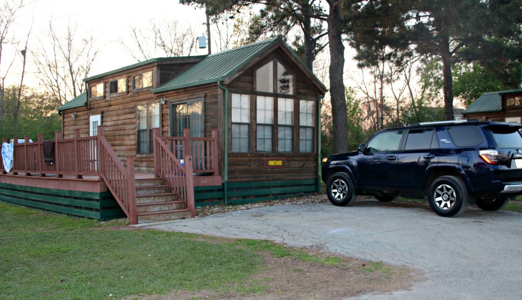 Log cabin with SUV