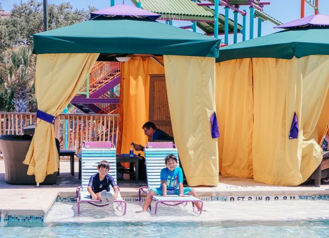 Two boys outside premium cabana at Aquatica San Antonio