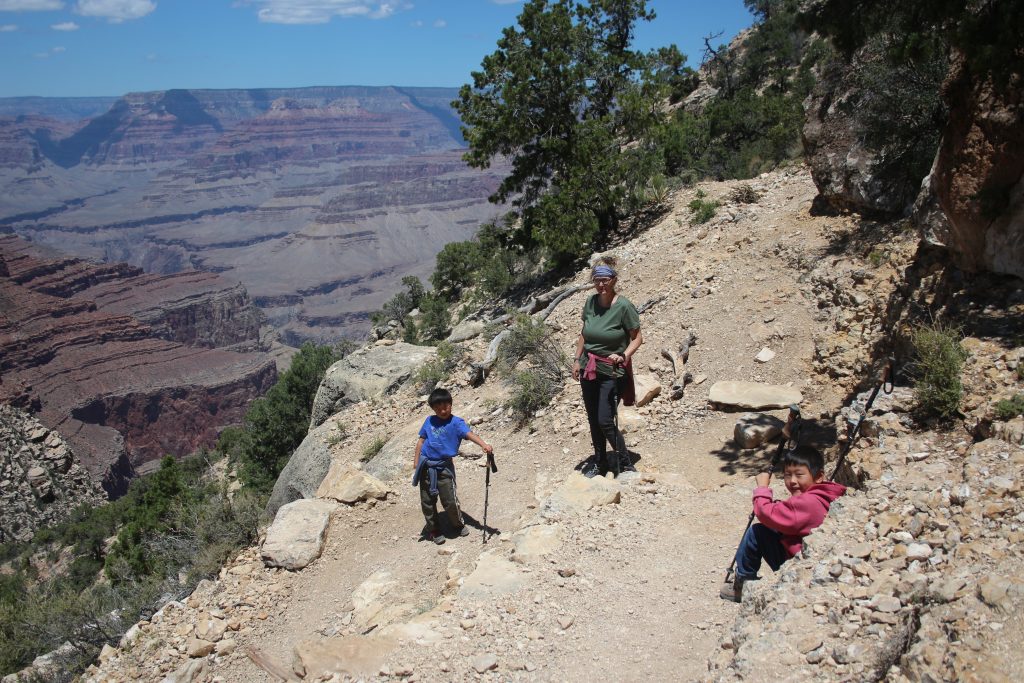 Best Places to stop on a Southwest Road Trip\Woman and two boys hiking
