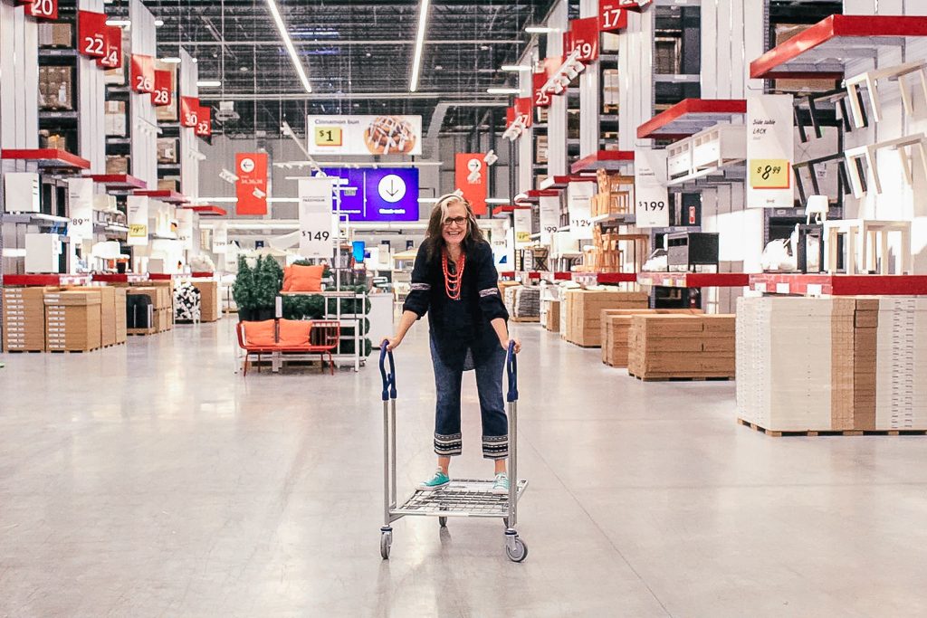 Should bloggers and influencers charge a day rate or an event fee?|Woman on a cart at Ikea Store