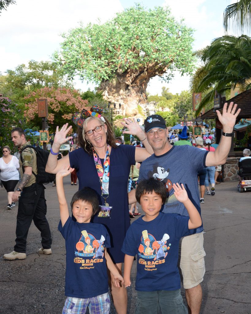 Disney Wine and Dine Half Marathon Weekend - Your Questions Answered|Run Disney Ripped Jeans and Bifocals Family in front of tree of life at Disney's Animal Kingdom