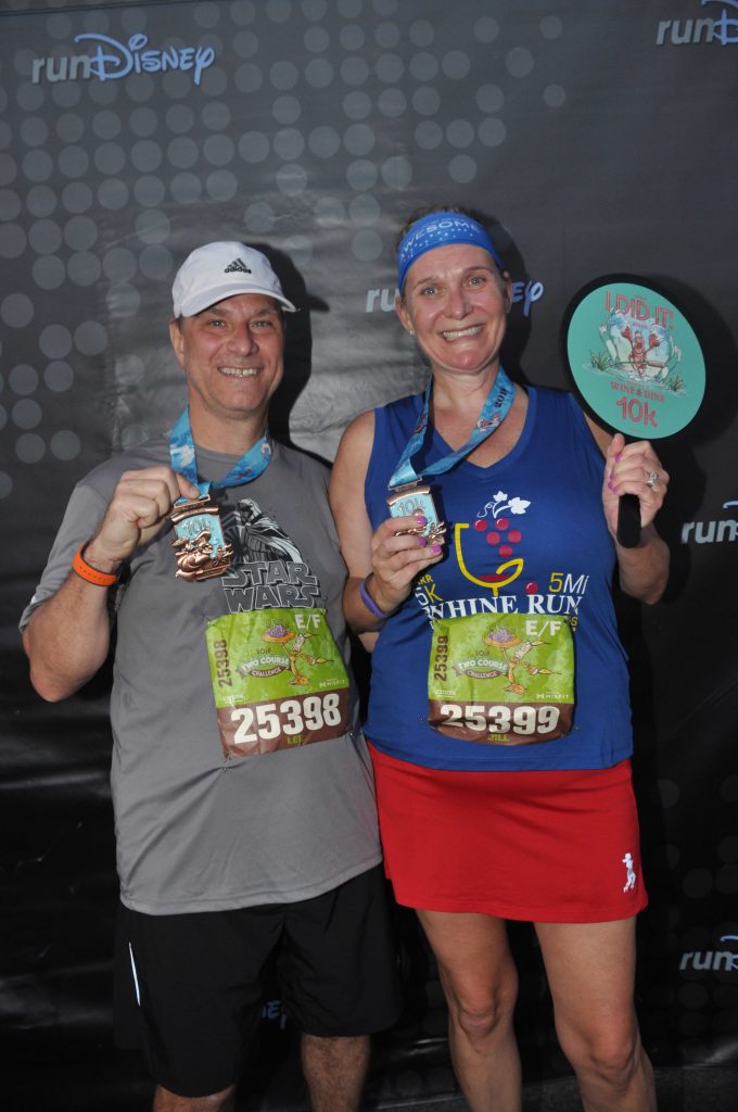 Disney Wine and Dine Half Marathon Weekend - Your Questions Answered|Run Disney Ripped Jeans and Bifocals Man and woman in running clothes with finisher medals