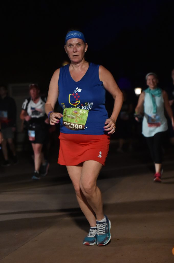 Disney Wine and Dine Half Marathon Weekend - Your Questions Answered|Run Disney Ripped Jeans and Bifocals Woman in red skirt and blue shirt running