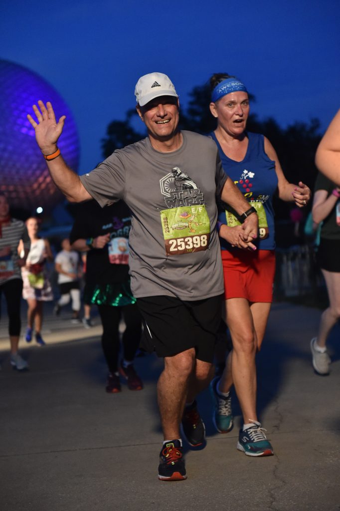 Disney Wine and Dine Half Marathon Weekend - Your Questions Answered|Run Disney Ripped Jeans and Bifocals man and woman running together at Epcot