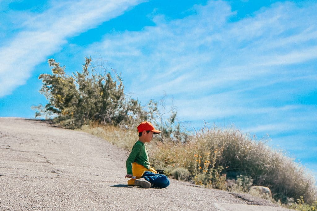 The Complete Guide to Tempe with Kids|Little boy hiking A Mountain in Tempe AZ