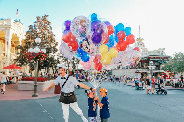 Disney World Planning can teach you where the best photo spots are|Little boys with balloons at the Magic Kingdom