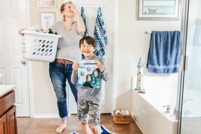Mom with laundry basket Febreze small spaces