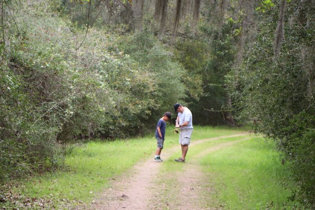 Man and boy with metal detector