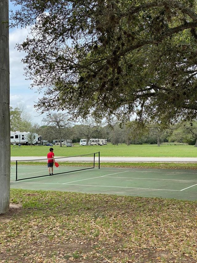 Boy playing pickle ball