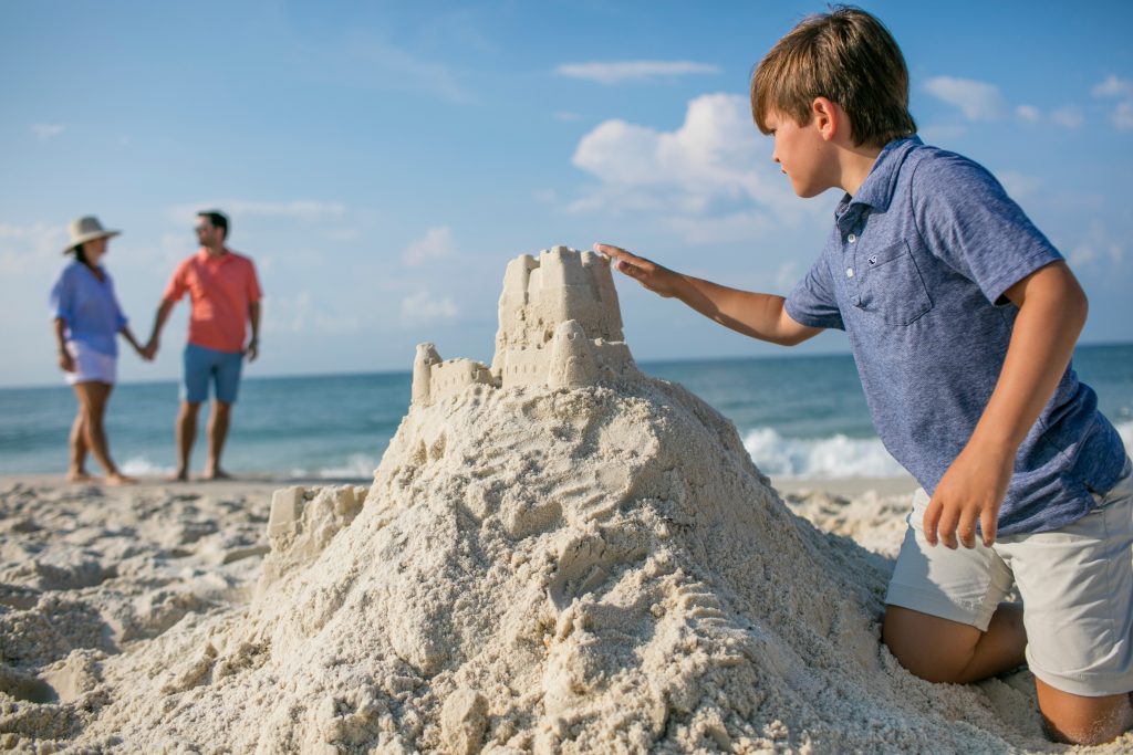 boy making sandcastle Gulf Shores