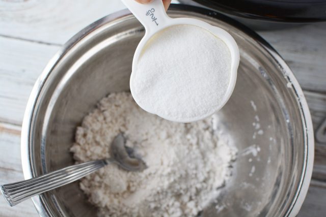 Bisquick and sugar in a metal bowl