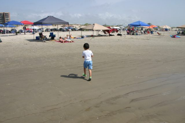 Little boy running on the beach