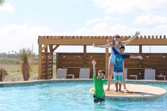 Mom and two kids in pool