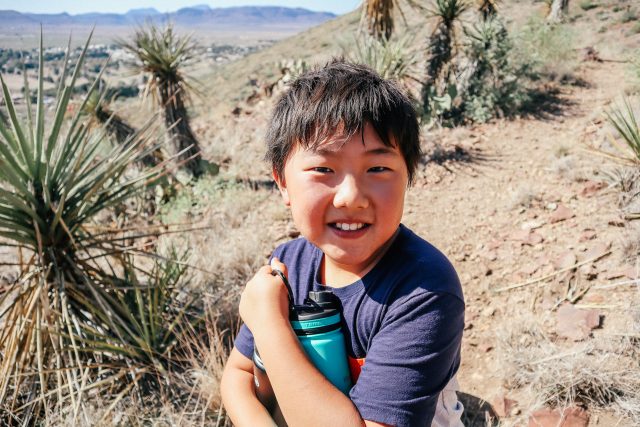 Boy with water bottle in West Texas