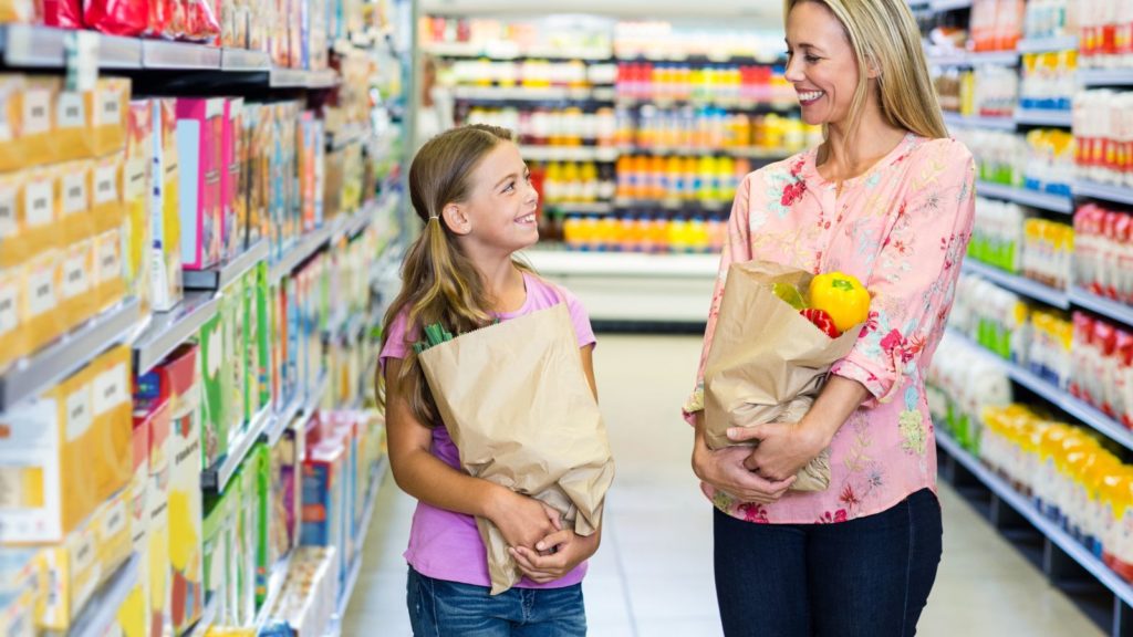 Mom and daughter at grocery store.