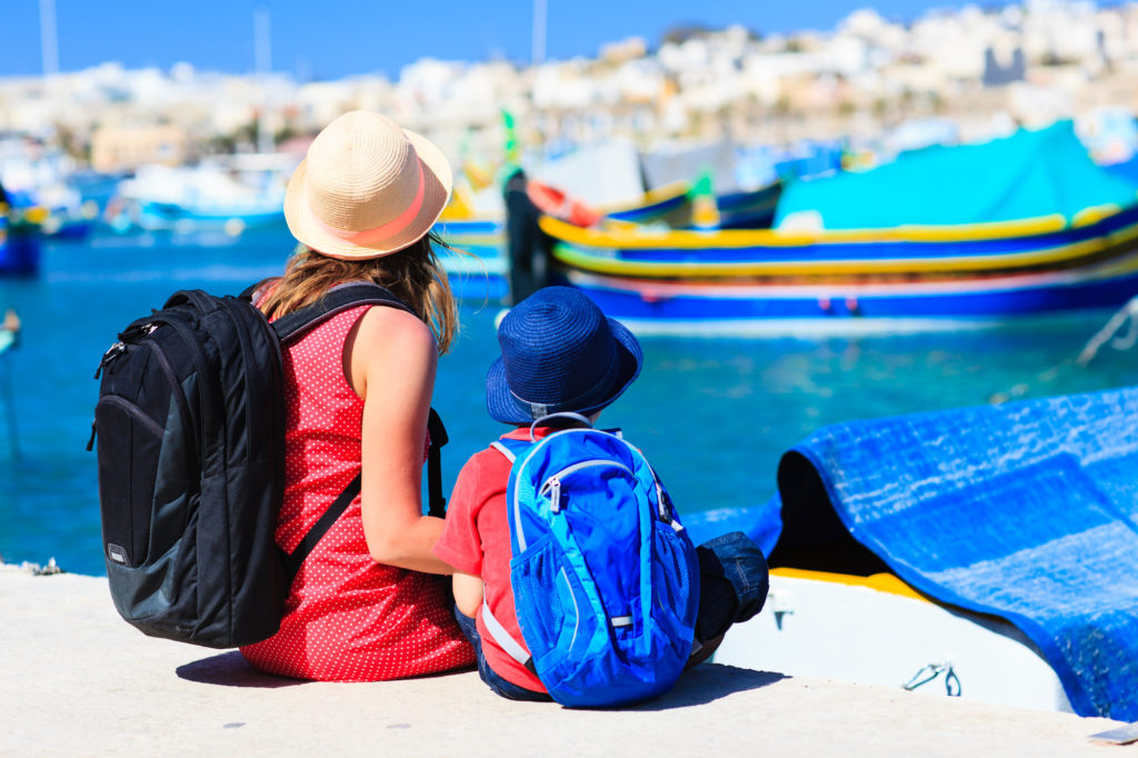 Mother and son traveling.