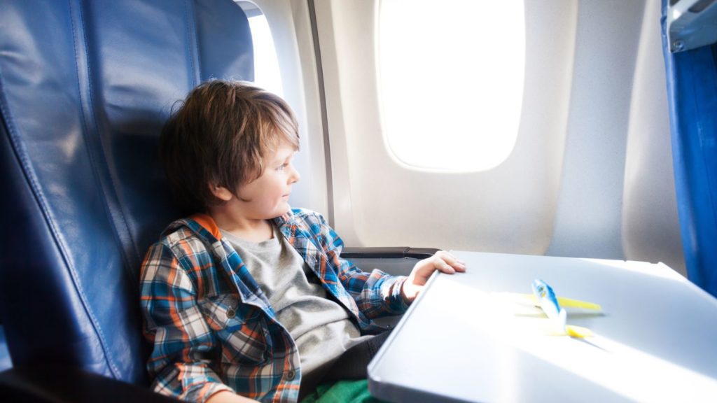 Child on an airplane.