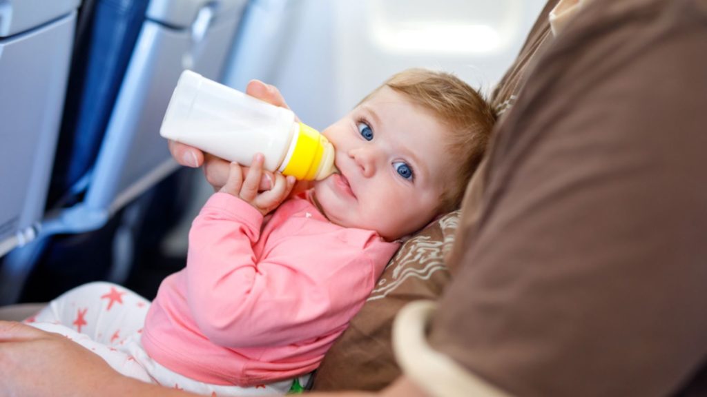 Baby om a plane.