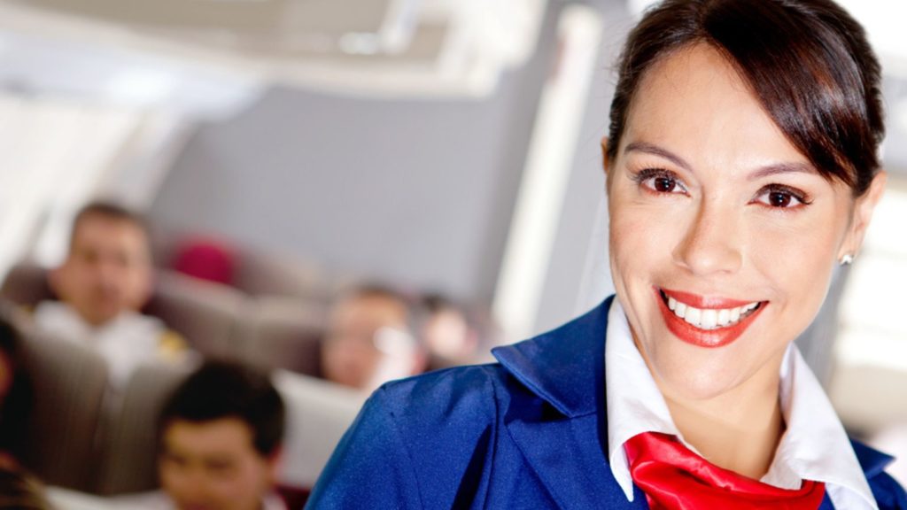 Smiling flight attendant.