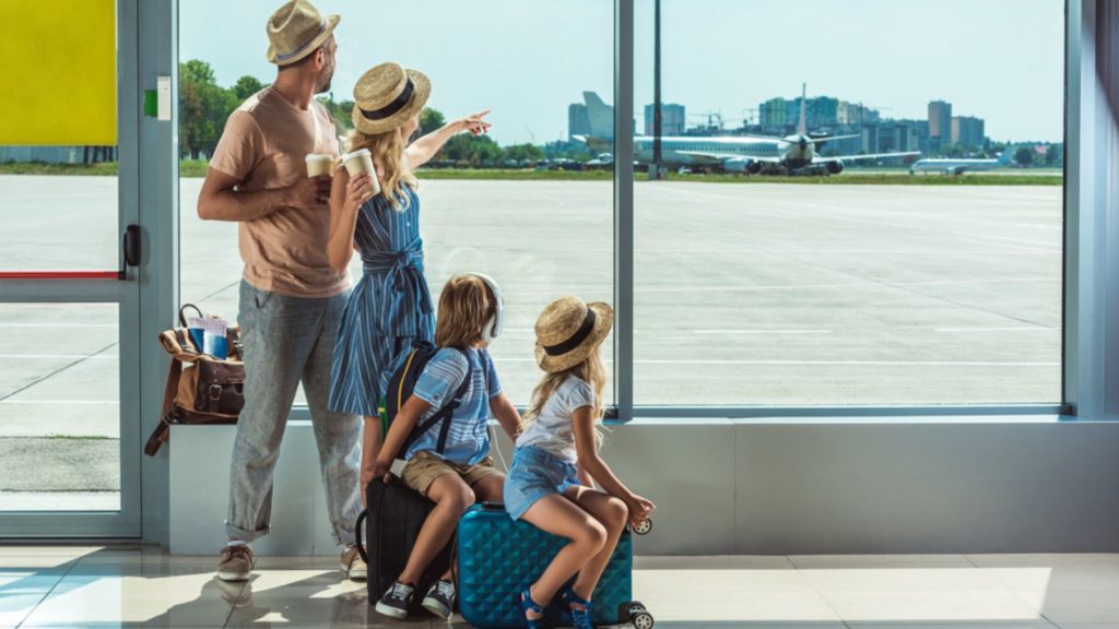 Family traveling together at the airport.