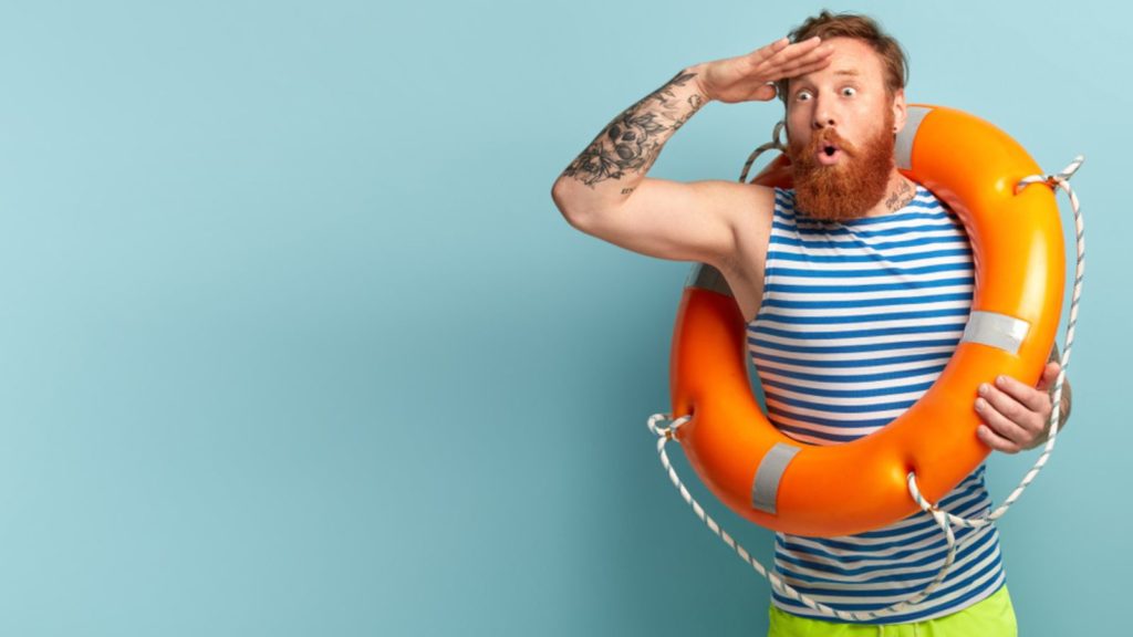 Man in a blue striped shirt with a life preserver.