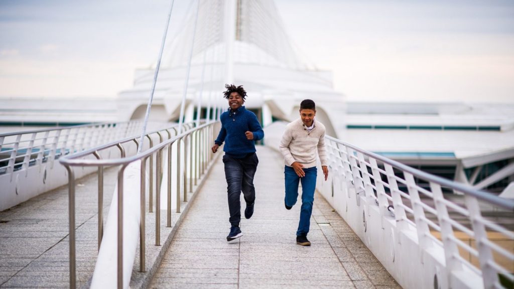 Kids running in front of Milwaukee Art Museum.