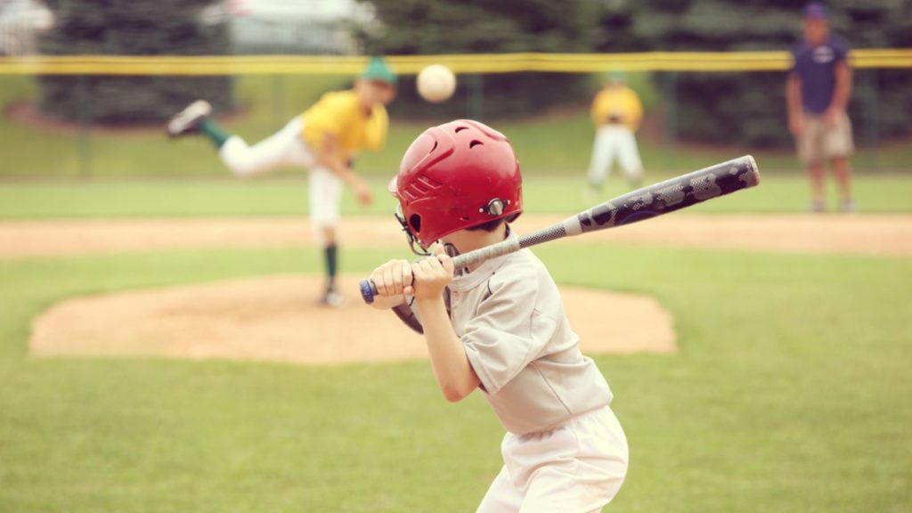 Boy playing baseball.